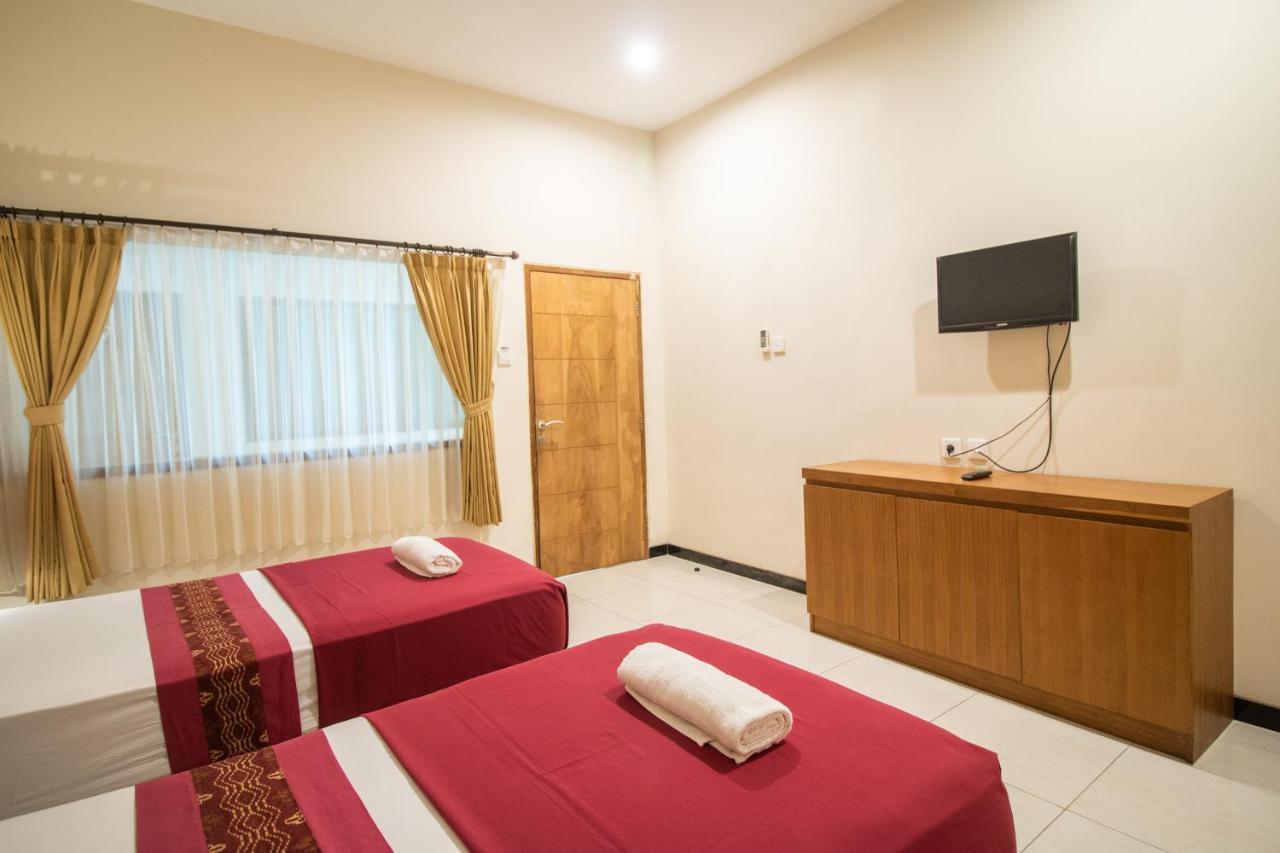 Kuta Suci Guesthouse מראה חיצוני תמונה