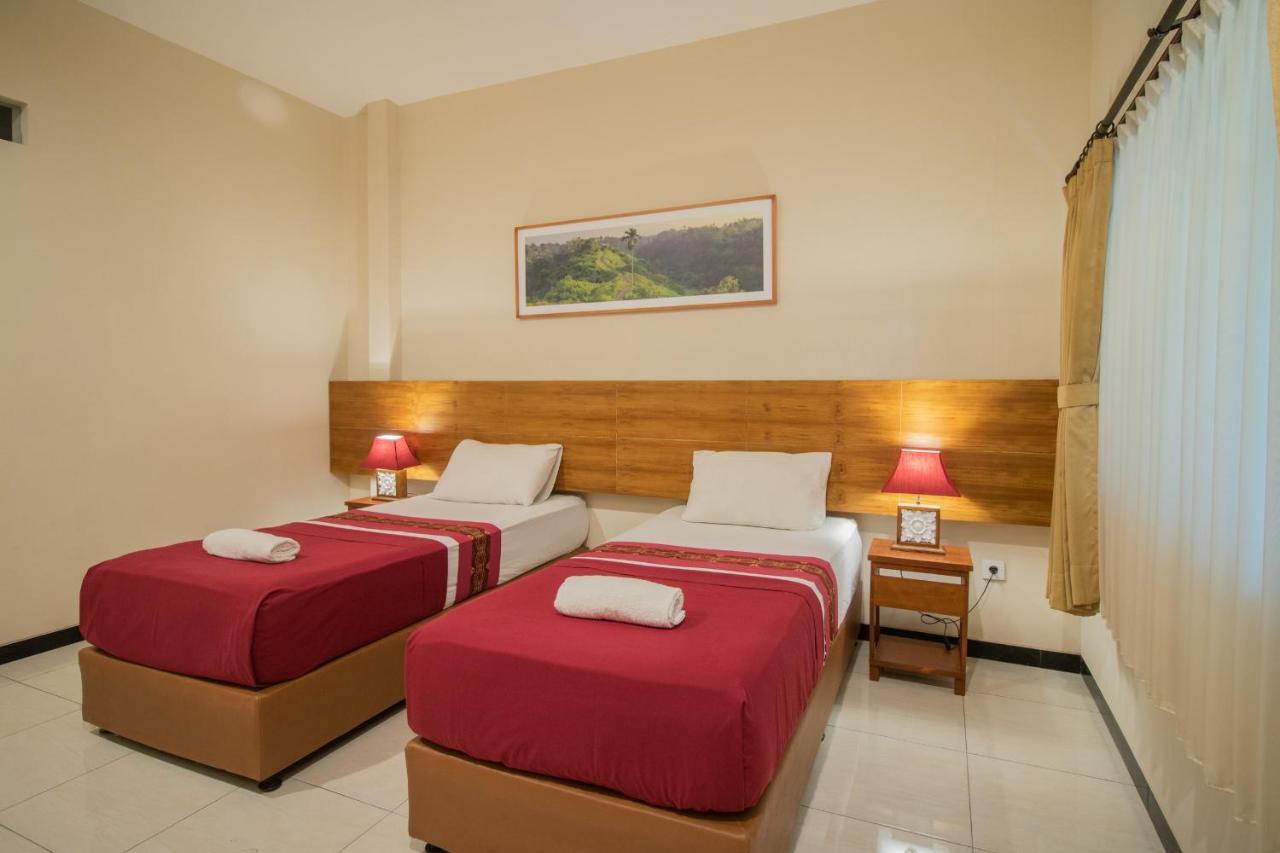 Kuta Suci Guesthouse מראה חיצוני תמונה