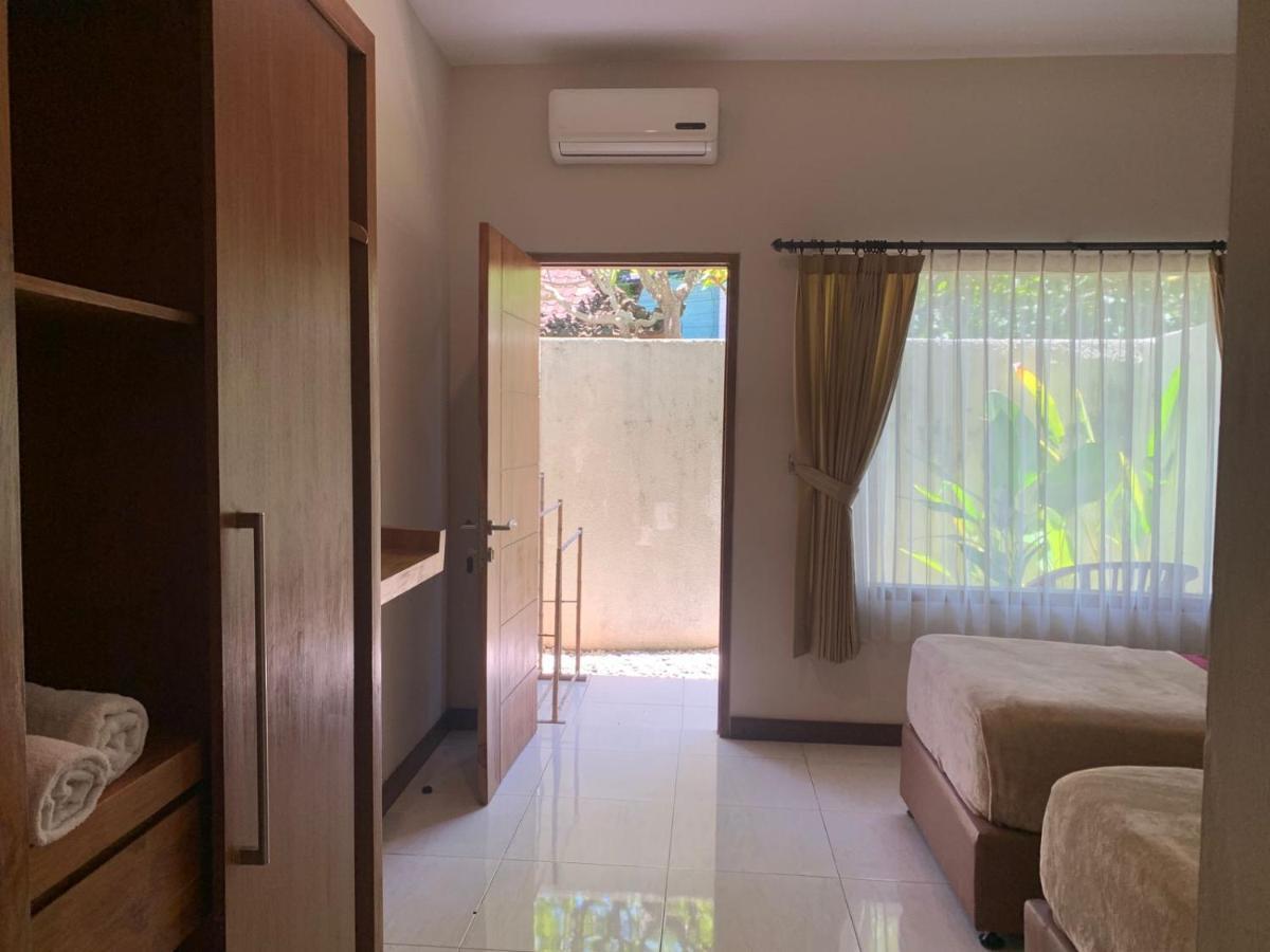 Kuta Suci Guesthouse מראה חיצוני תמונה